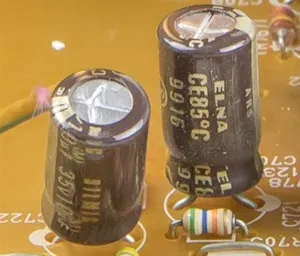 Two electrolytic capacitors on a circuit board