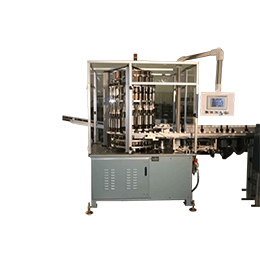 CONTINUOUS MOTION MULTIPLE PIECE ASSEMBLY MACHINE