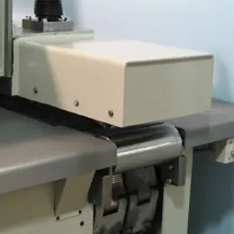 OUTFEED ROLL AND EXTENDED PRESSURE BEAM